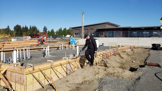 Technician Kris Elling pre-treating a commercial construction site WA