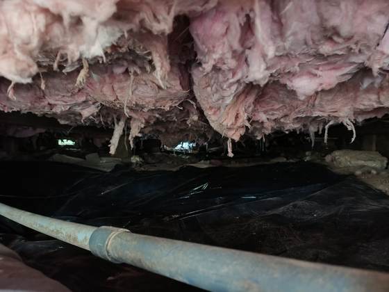Subfloor insulation in a crawlspace