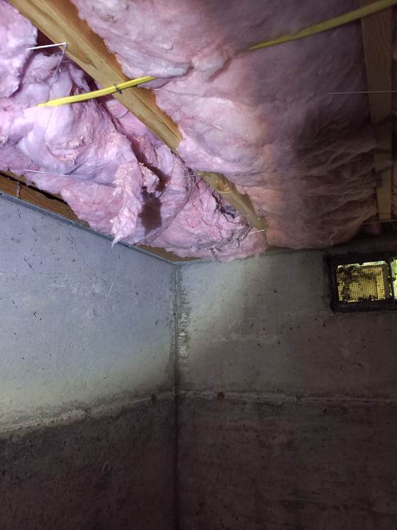 Pink insulation in a crawlspace