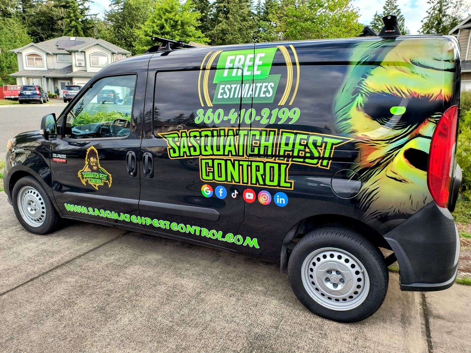 The side of a wrapped Sasquatch Pest Control van showing the company name, phone number and free estimates graphic